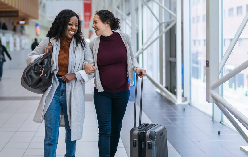 Pregnant Woman Traveling by Plane with Female Companion