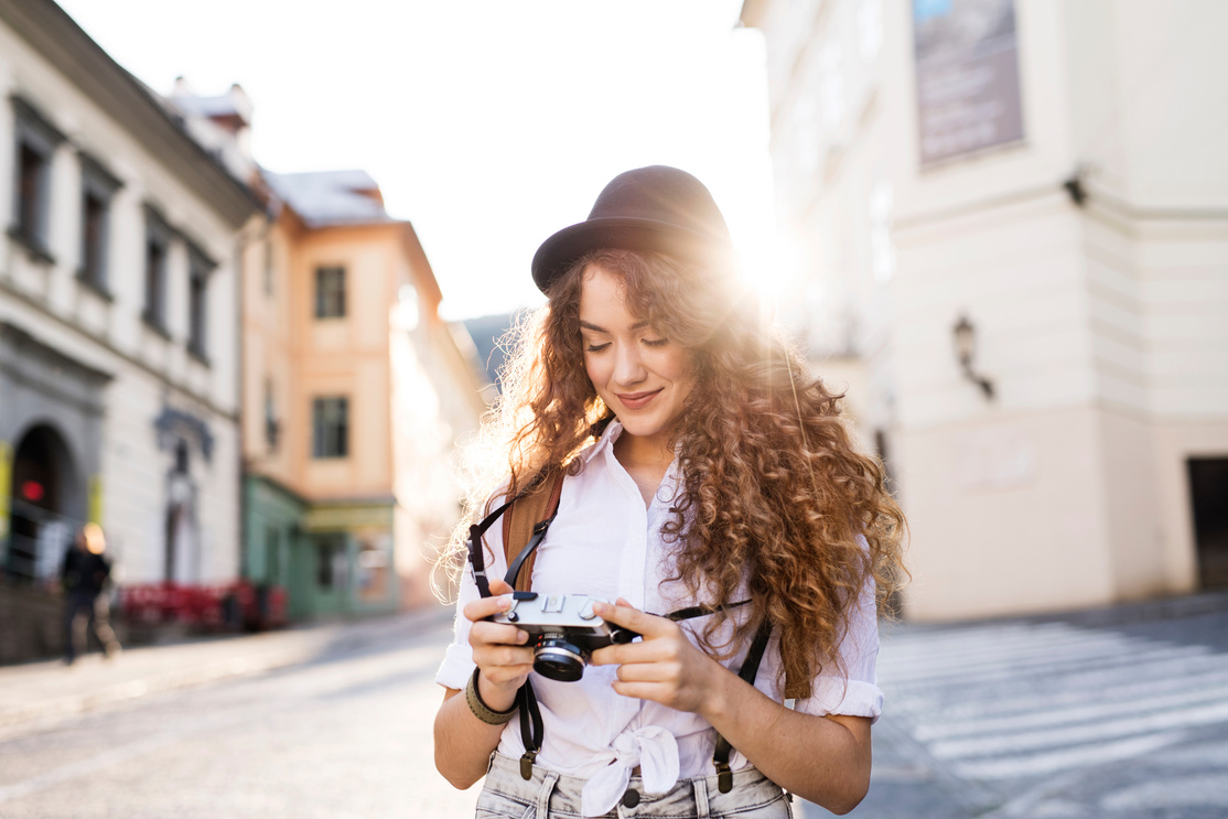 Young Tourist with Camera